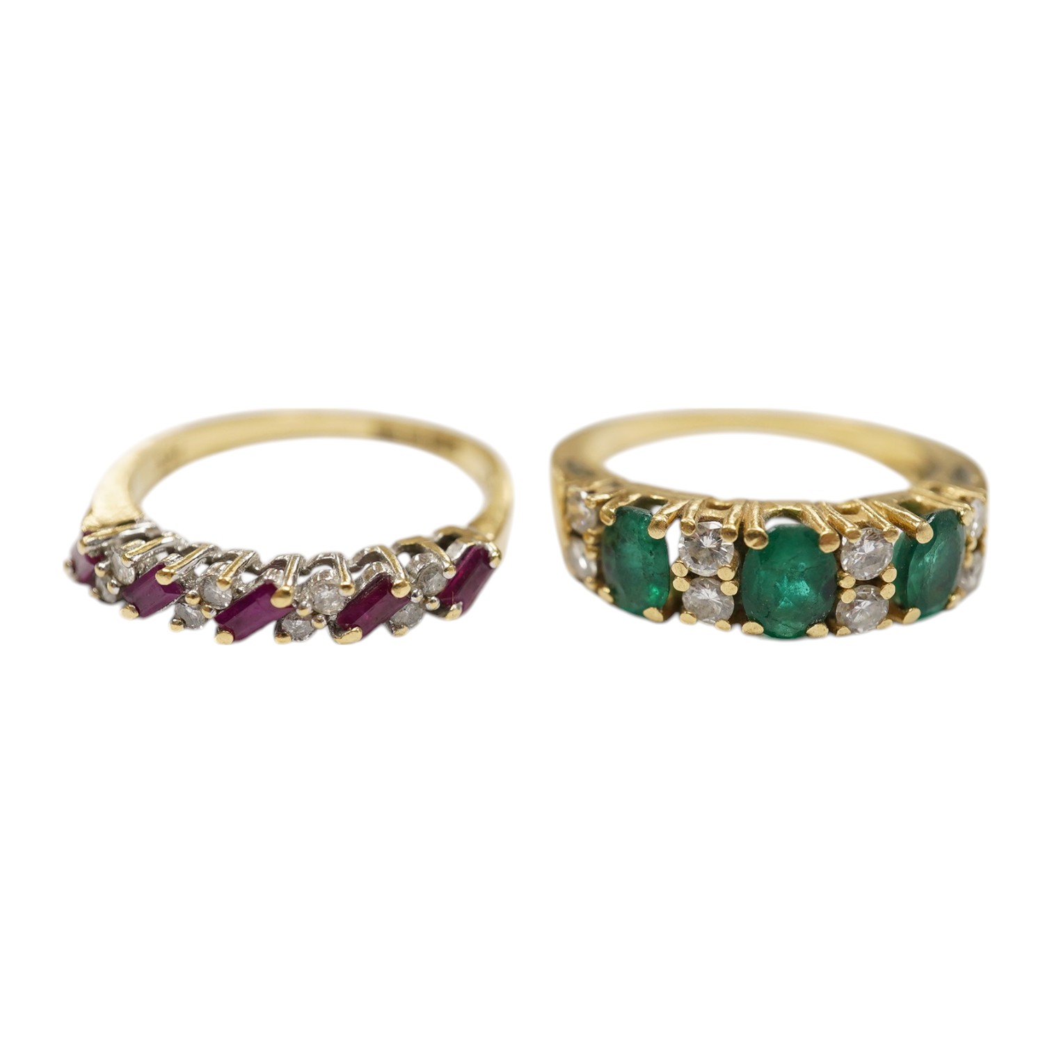 A modern 18ct gold, ruby and diamond set half hoop ring, size M and a yellow metal emerald and diamond set half hoop ring, size L/M, gross weight 6 grams. Condition - poor to fair